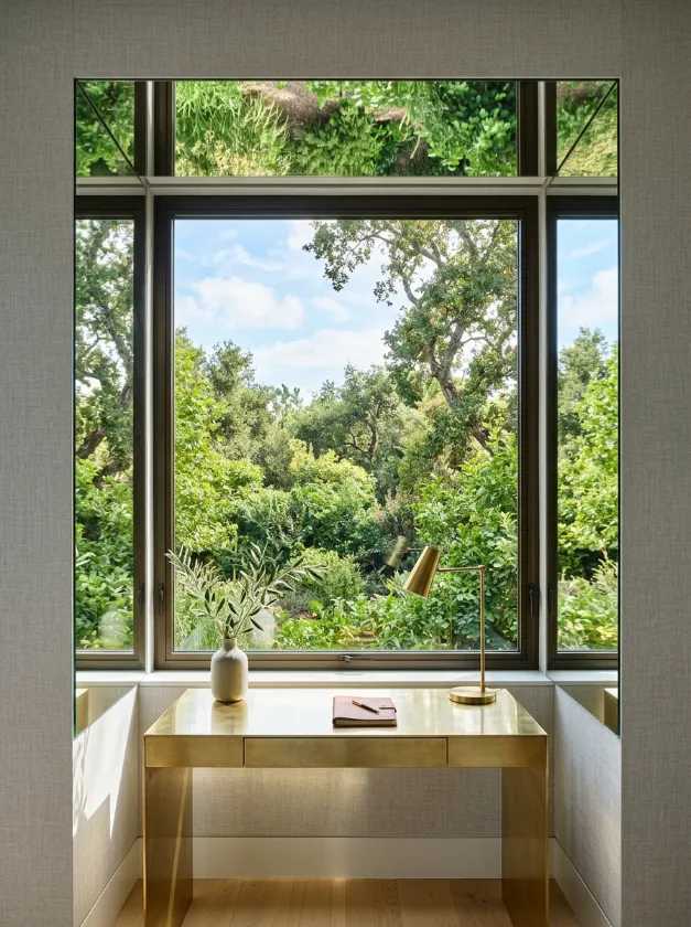 Window frame lined with mirrors to reflect outdoor views.