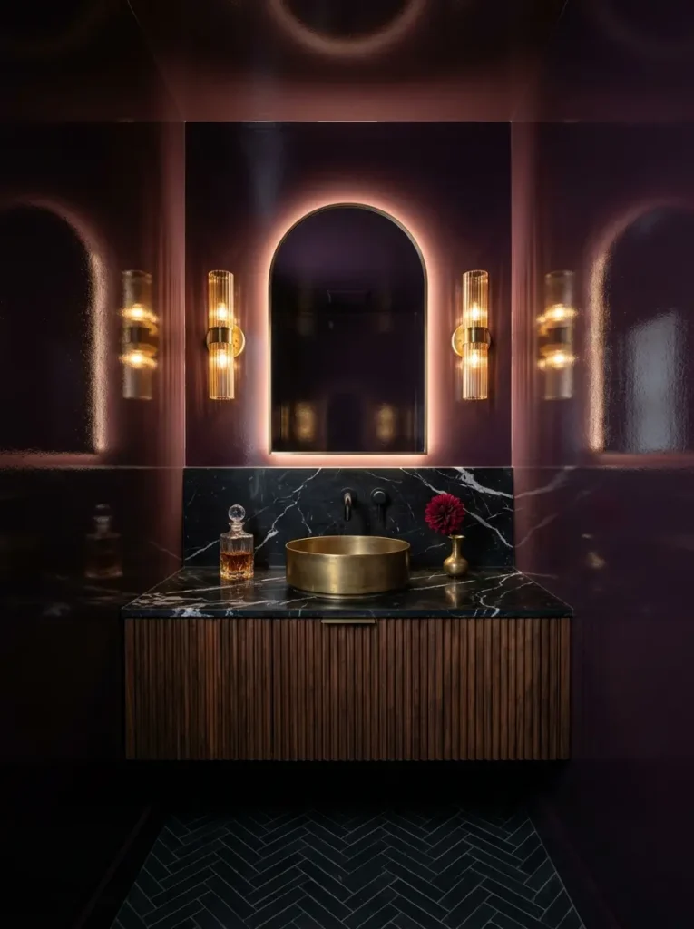 Burgundy Red Luxury Bathroom Glossy burgundy walls with brass sink and dark vanity