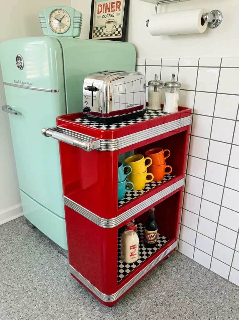 Bright red cart with chrome trim and checkered shelves holding a toaster