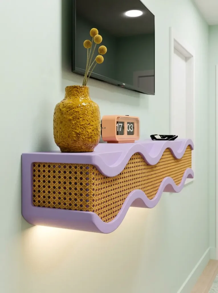Floating lilac shelf with wavy borders and a woven rattan front panel under a television.