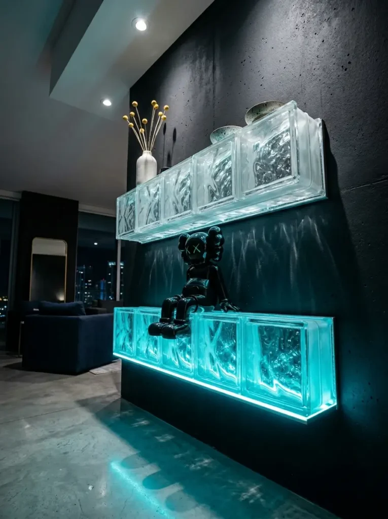 Textured clear glass block shelves emitting bright cyan neon light holding a dark figurine.