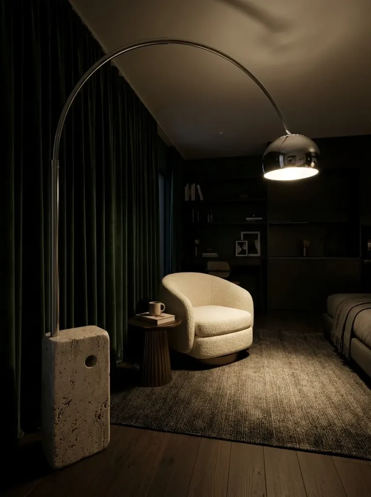 Large chrome sculptural arch lamp providing targeted lighting for dark apartments.