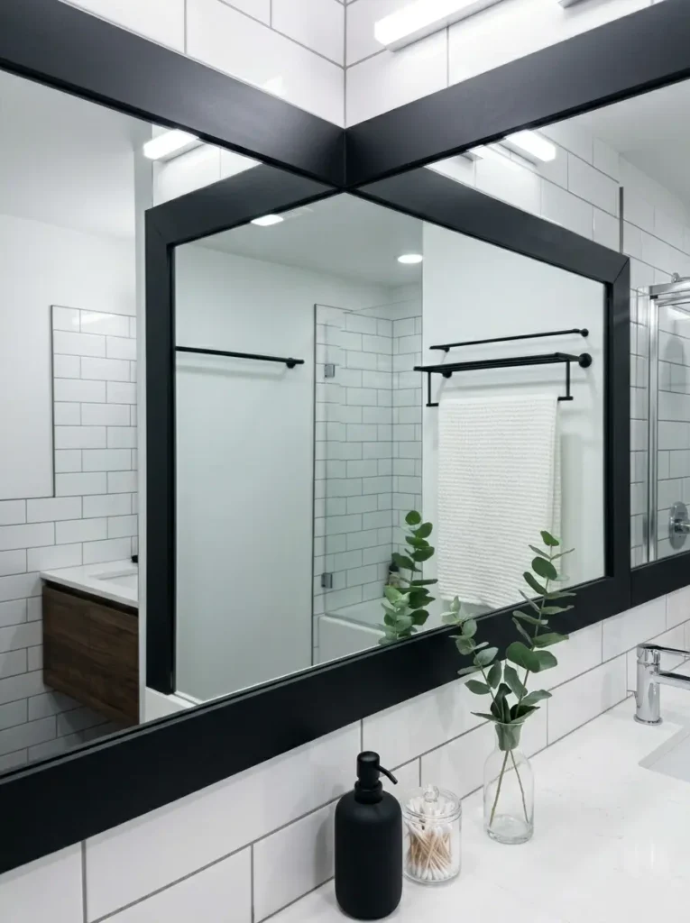 Builder grade bathroom mirror upgraded with a thick black border trim