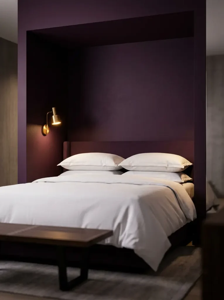 Painted Bed Alcove Bed tucked into a recessed alcove painted entirely in dark plum purple.