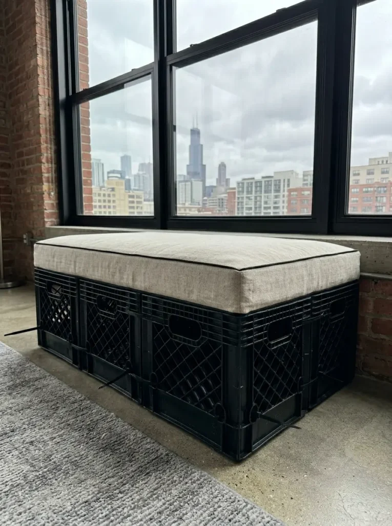 Window seating bench built using zip tied black milk crates and a custom linen cushion