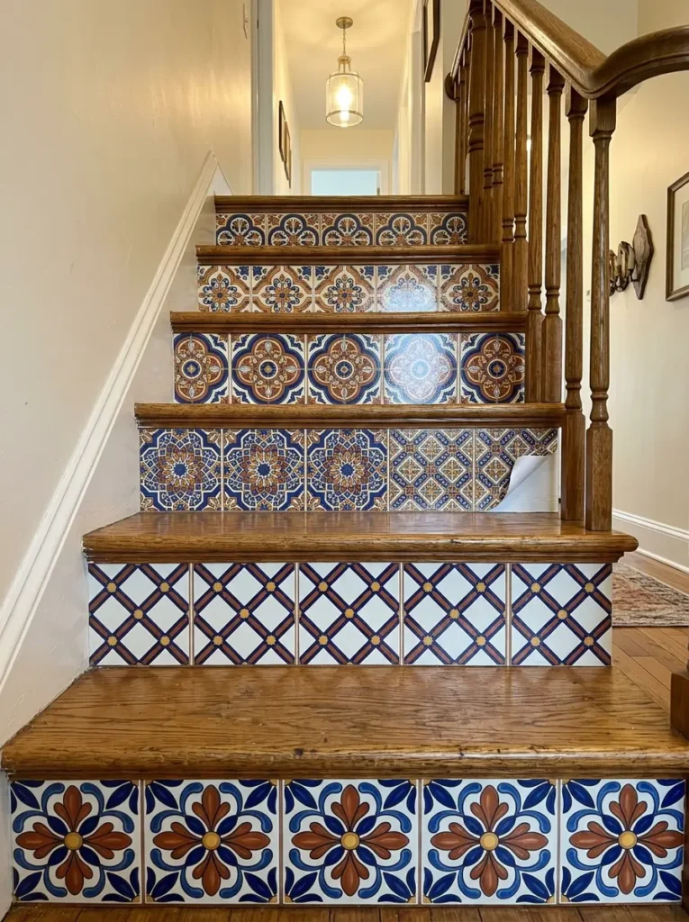 Wooden staircase featuring vibrant blue and brown tile decals on the risers