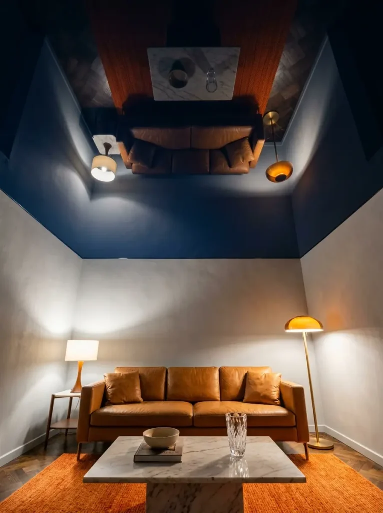 High gloss dark blue ceiling reflects the living room furniture below