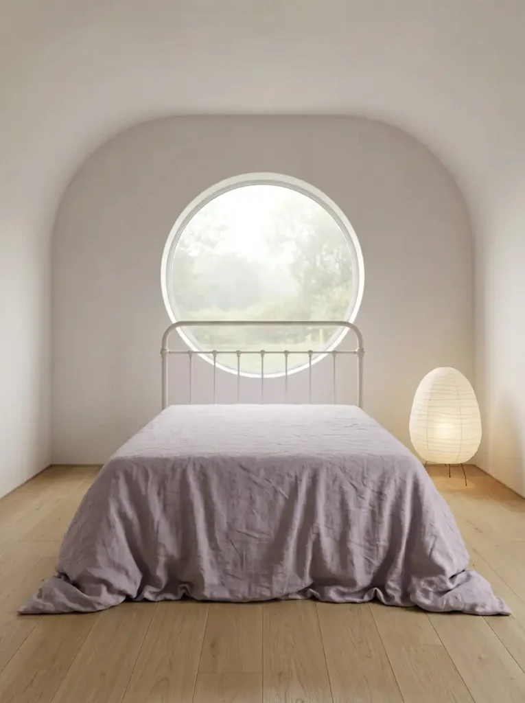 Zen bedroom with circular window