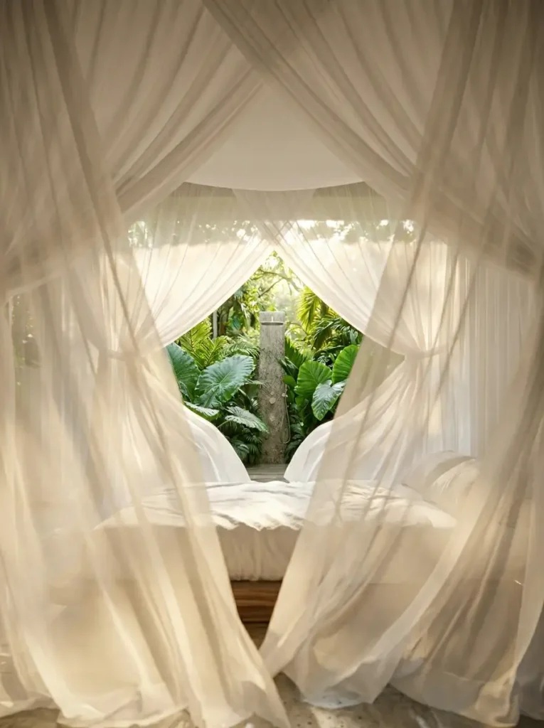 White canopy curtains framing tropical outdoor view