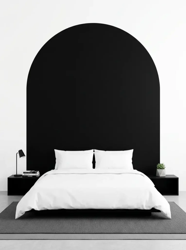 Painted black arch on white wall behind bed
