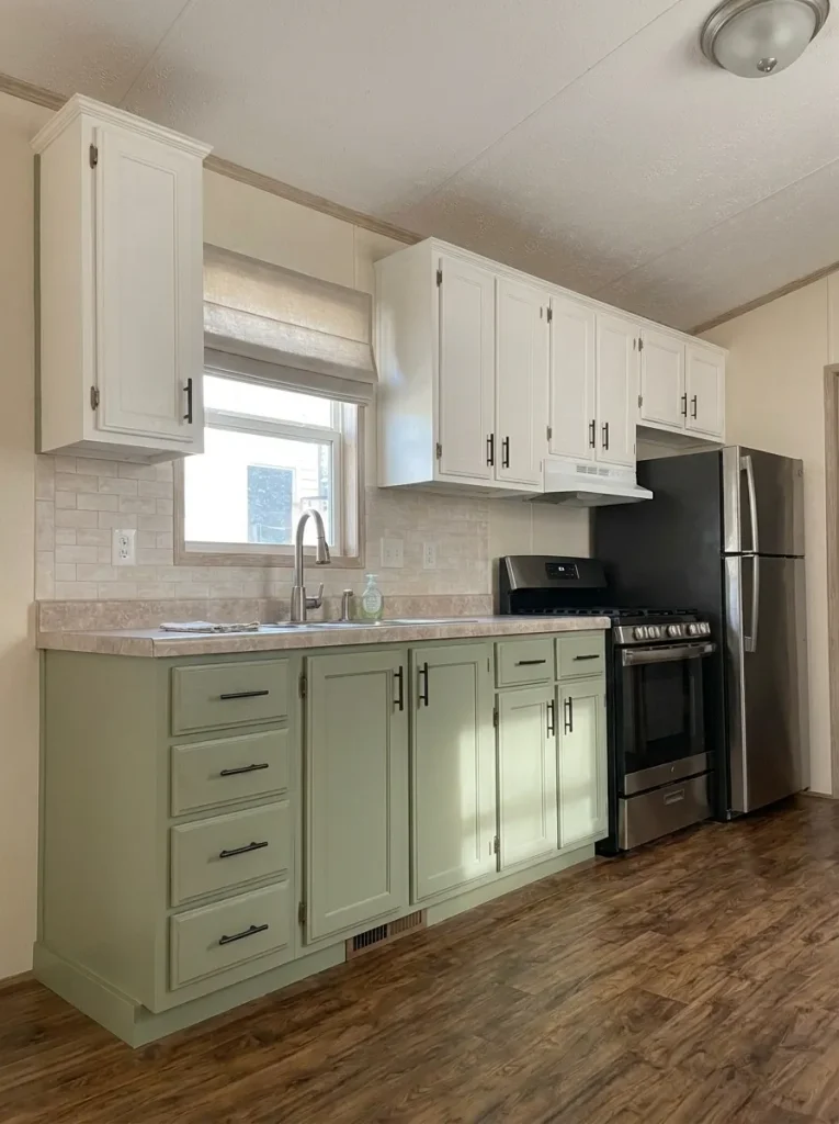 Mobile-home sink window with a simplified neutral treatment that keeps privacy while reducing visual clutter