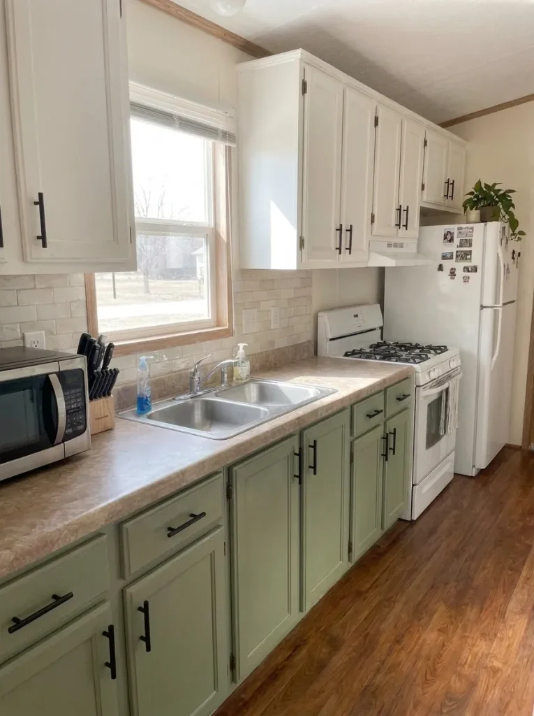 Mobile-home kitchen with a restrained peel-and-stick backsplash used on a compatible wall section between the cabin