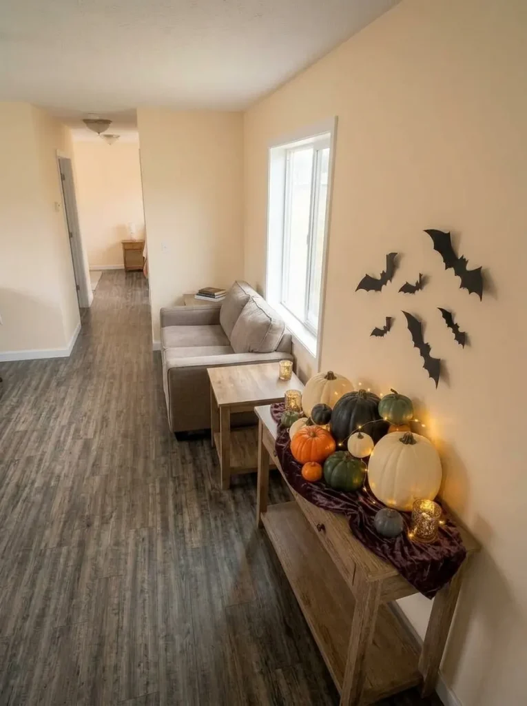 Finished mobile home Halloween living room after editing, with one strong focal scene, quiet surfaces and open circulation.