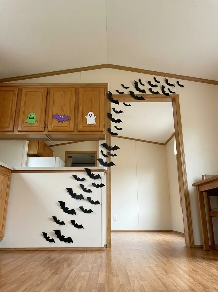 Flat vertical decorations create the visual density of a 90s Halloween display without consuming valuable floor or counter space.
